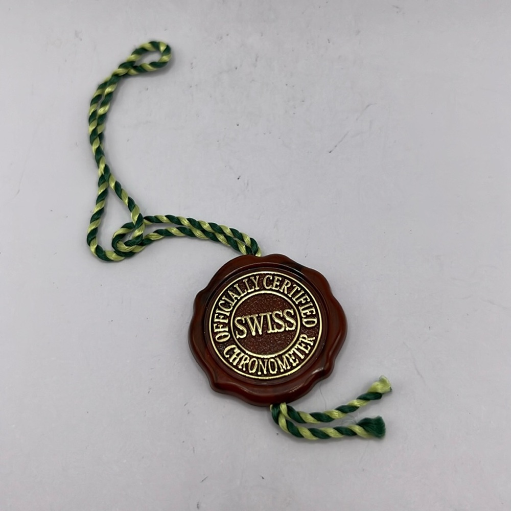 Rolex hologram maroon hang tag